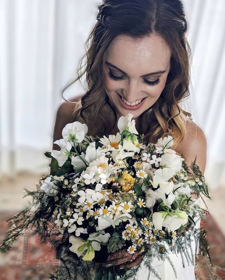 Hayley on her wedding day at Doddington hall. Flowers by Rachel Petheram at Catkin flowers. Hair by Hannah Blinko.